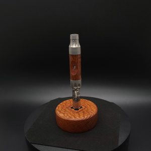This image portrays DynaPuck-Single Dynavap Stem Display-Leopard Wood by Dovetail Woodwork.