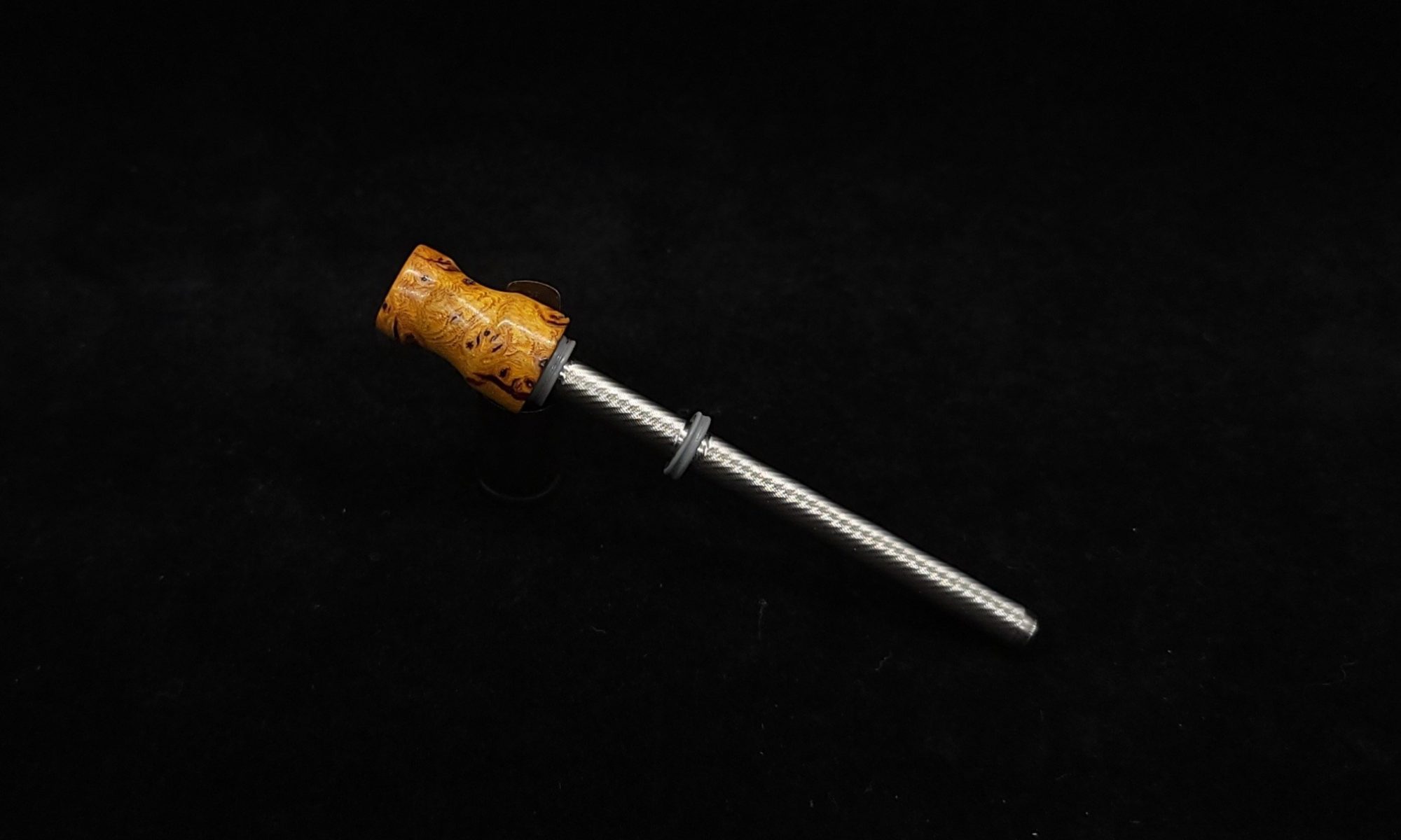 This image portrays Dynavap Spinning Mouthpiece-Wormy Black Walnut Burl Hybrid by Dovetail Woodwork.