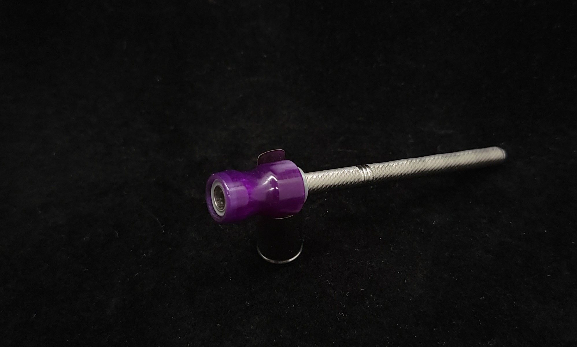 This image portrays Dynavap Spinning Mouthpiece-Galactic Purple/Pearl White by Dovetail Woodwork.