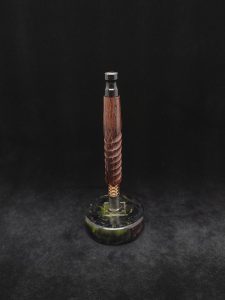 This image portrays Twisted Stems Series-Eclipse XL Dynavap Stem/Banksia Pod Hybrid w/Black Resin M.P. by Dovetail Woodwork.