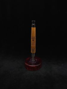 This image portrays High Class-Knurled XL Dynavap Stem/Lignum Vitae with Ebony Mouthpiece by Dovetail Woodwork.