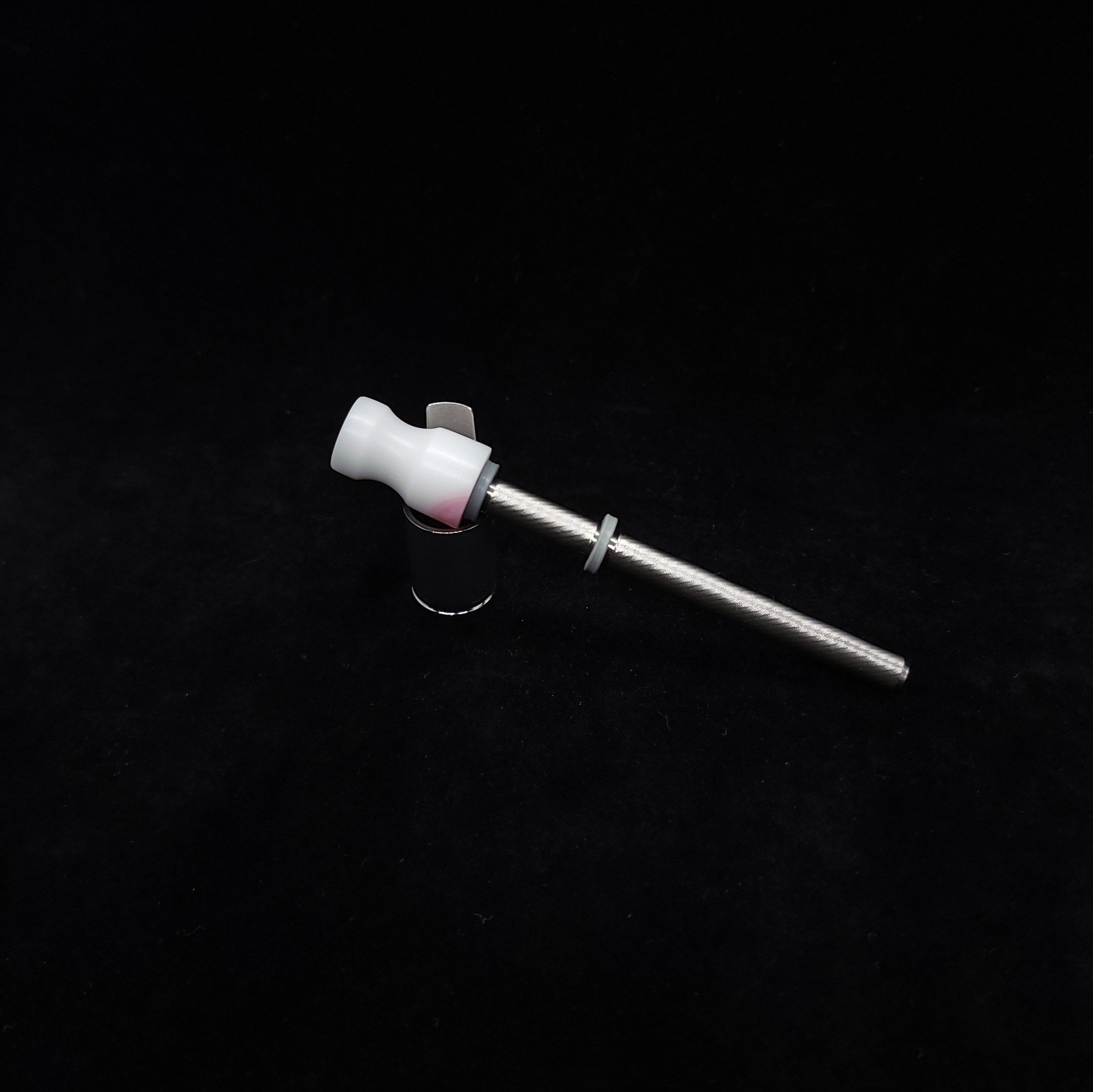 This image portrays Dynavap Spinning Mouthpiece-Matte White/Pink Accents by Dovetail Woodwork.