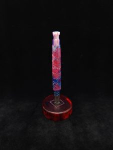 This image portrays High Class-Knurled XL Dynavap Stem/Luminescent Resin + Matching Mouthpiece by Dovetail Woodwork.