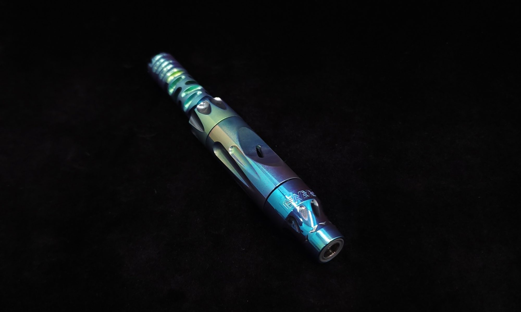 This image portrays Blue to Green-Custom Titanium Vong[i]/2023-Full Device(Ready to Ship) by Dovetail Woodwork.
