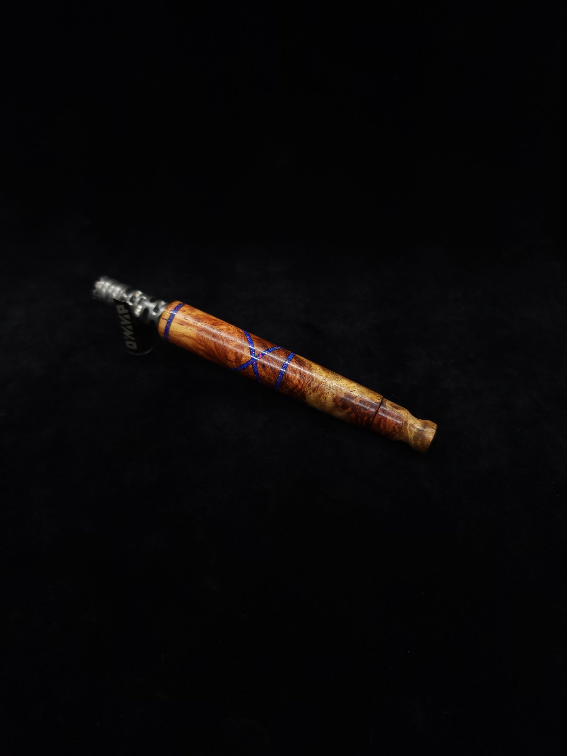 This image portrays Straight Taper XL Dynavap Stem + Amboyna Burl/Blue-Purple Opal Inlay+M.P. by Dovetail Woodwork.