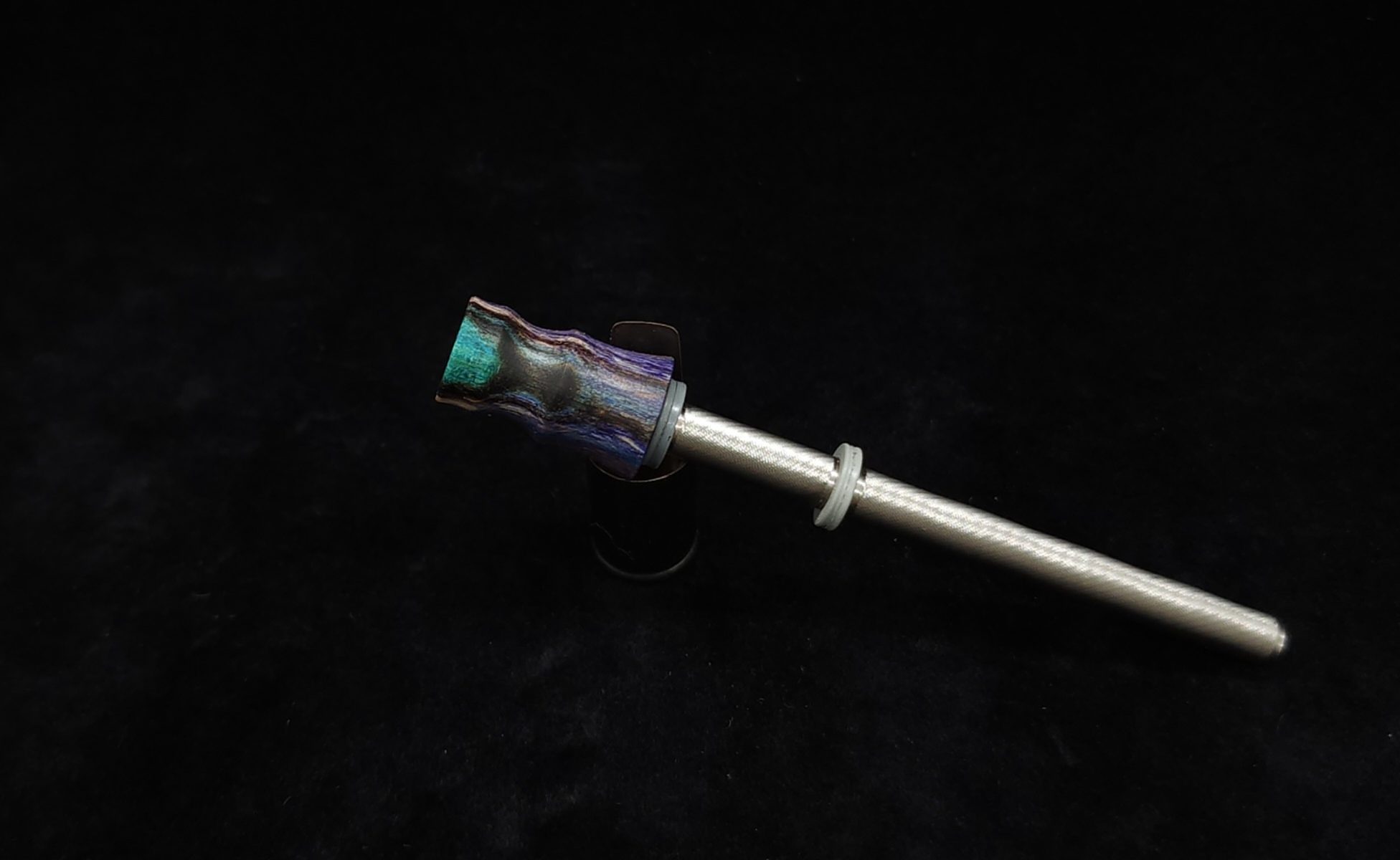 This image portrays Dynavap Spinning Mouthpiece-Spalted Tamarind Wood-Purple/Black/Teal by Dovetail Woodwork.