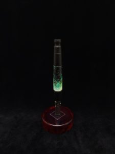 This image portrays Specialty Luminescent Widow Stem XL Dynavap Stem-Ebony Hybrid + M.P. by Dovetail Woodwork.