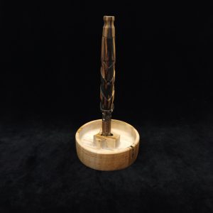 This image portrays DynaPuck XL-Wavy Maple Wood-Dynavap Stem Display/AVB Holder by Dovetail Woodwork.