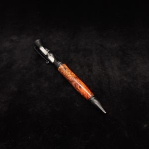This image portrays Amboyna Burl Wood-Matte Black Hourglass Pen by Dovetail Woodwork.