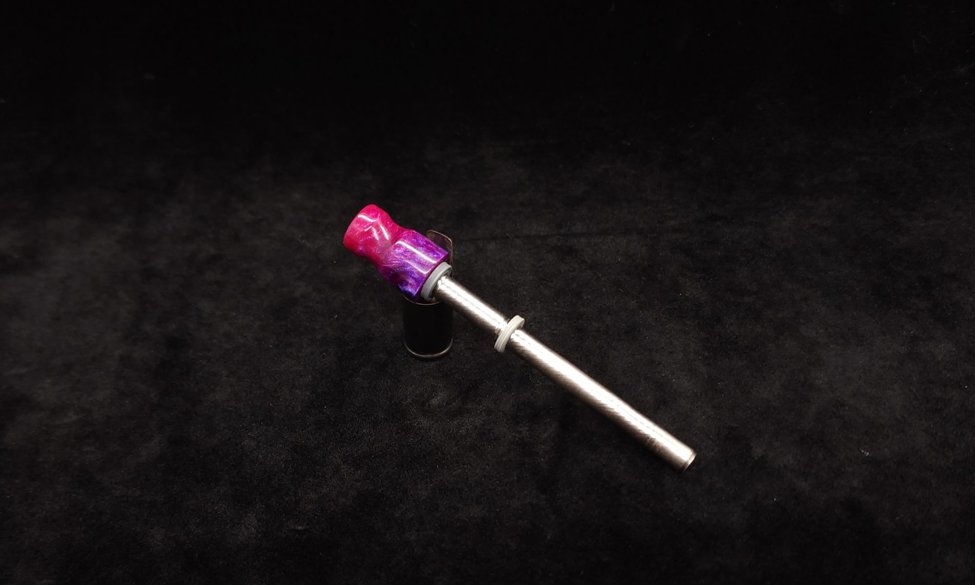 This image portrays Dynavap Spinning Mouthpiece-Metallic Pink/Purple by Dovetail Woodwork.