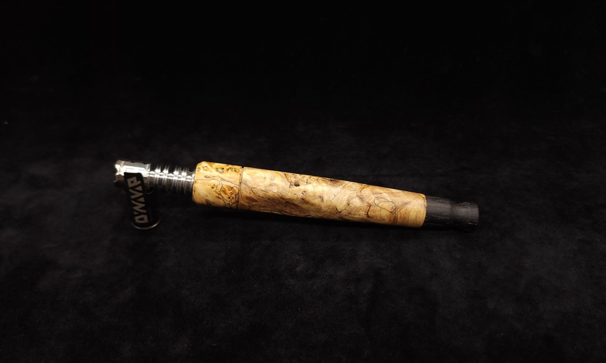 This image portrays Tapered Grip Dynavap Mixed Burl Stem + Ebony Mouthpiece by Dovetail Woodwork.