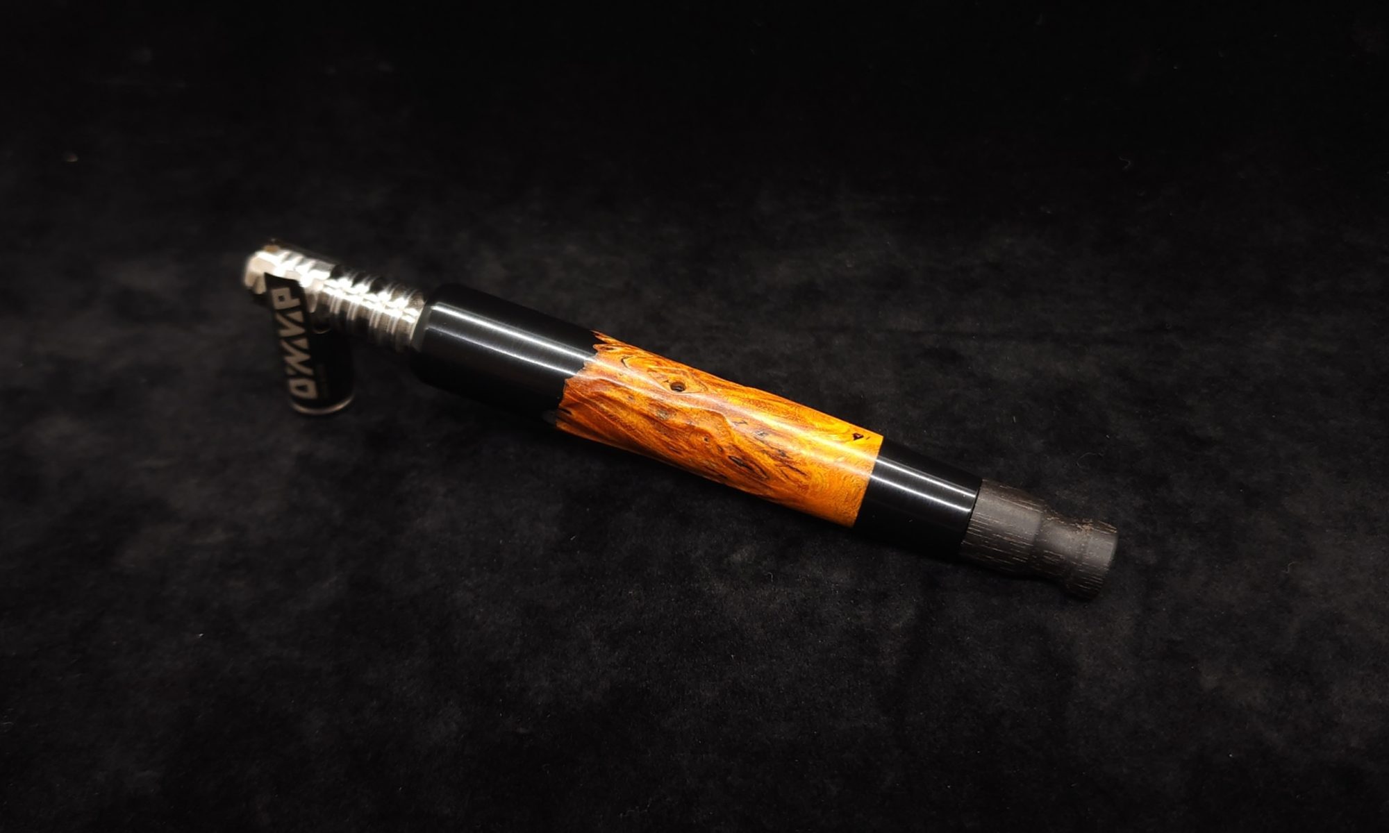 This image portrays Clutch Dynavap XL Burl Hybrid Stem + Ebony Mouthpiece by Dovetail Woodwork.