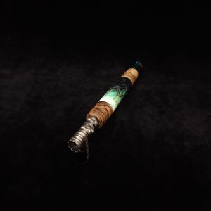 This image portrays Luminescent Widow Dynavap Stem XL-Hybrid + M.P. by Dovetail Woodwork.