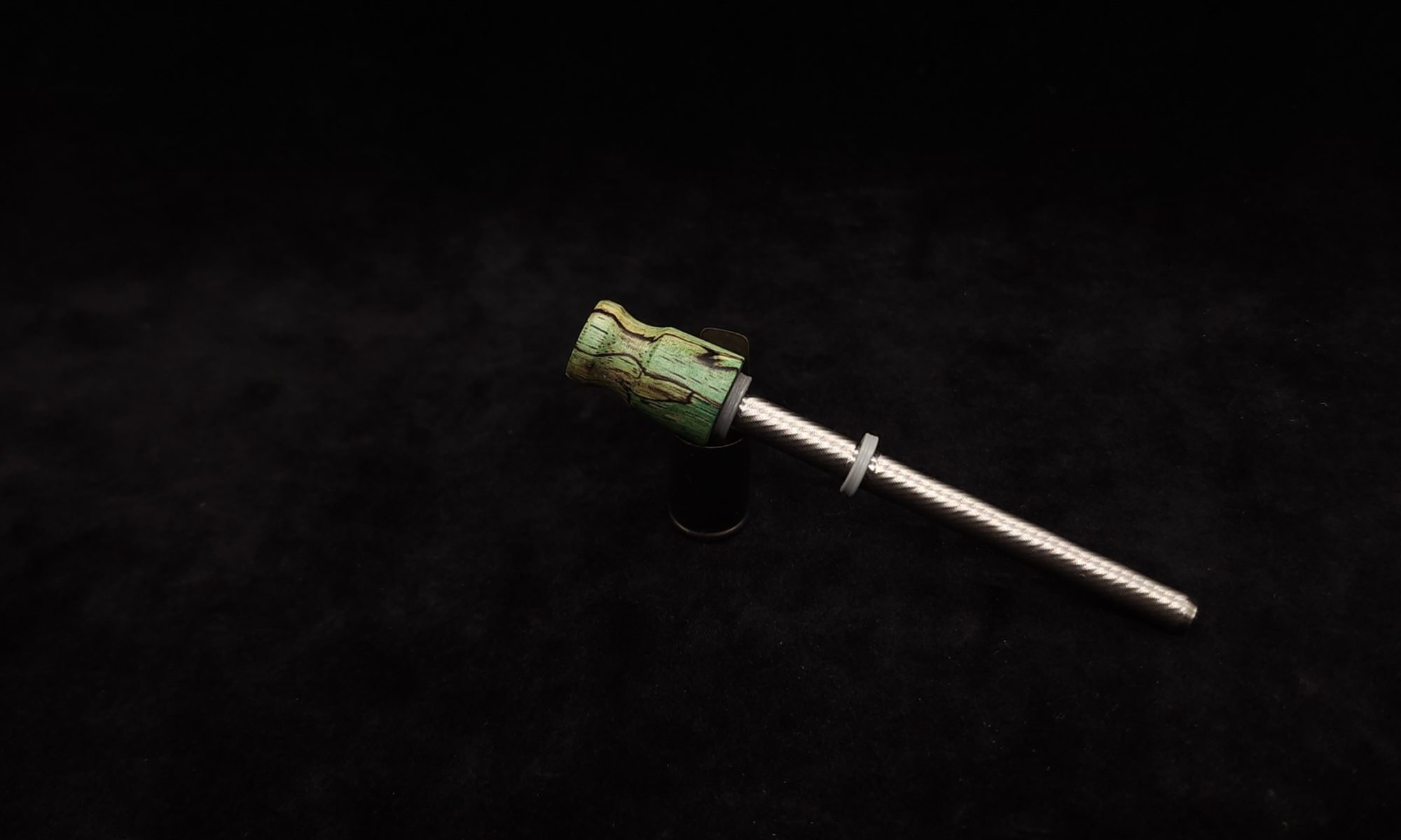 This image portrays Dynavap Spinning Mouthpiece-Blue/Green Spalted Tamarind by Dovetail Woodwork.