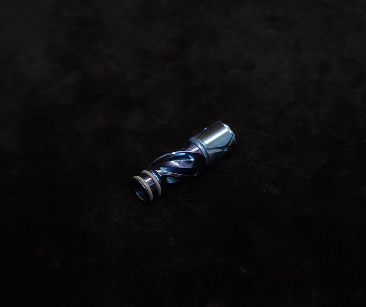 This image portrays Titanium Tip: HELIX-Cobalt Blue Anodized by Dovetail Woodwork.