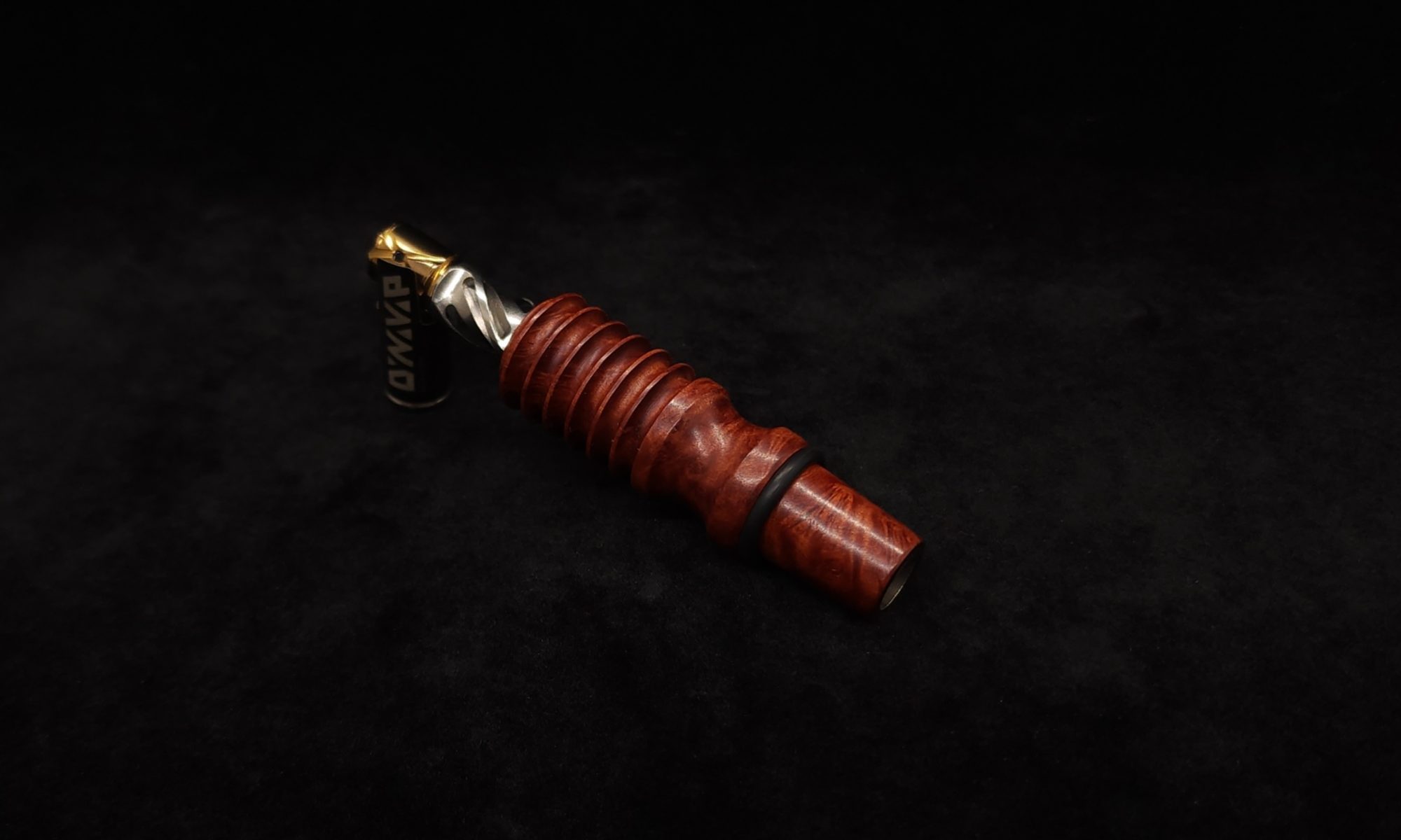 This image portrays Dynavap 14mm WPA Stem-S.S. Metal Core-Finned/Manzanita Burl-NEW! by Dovetail Woodwork.