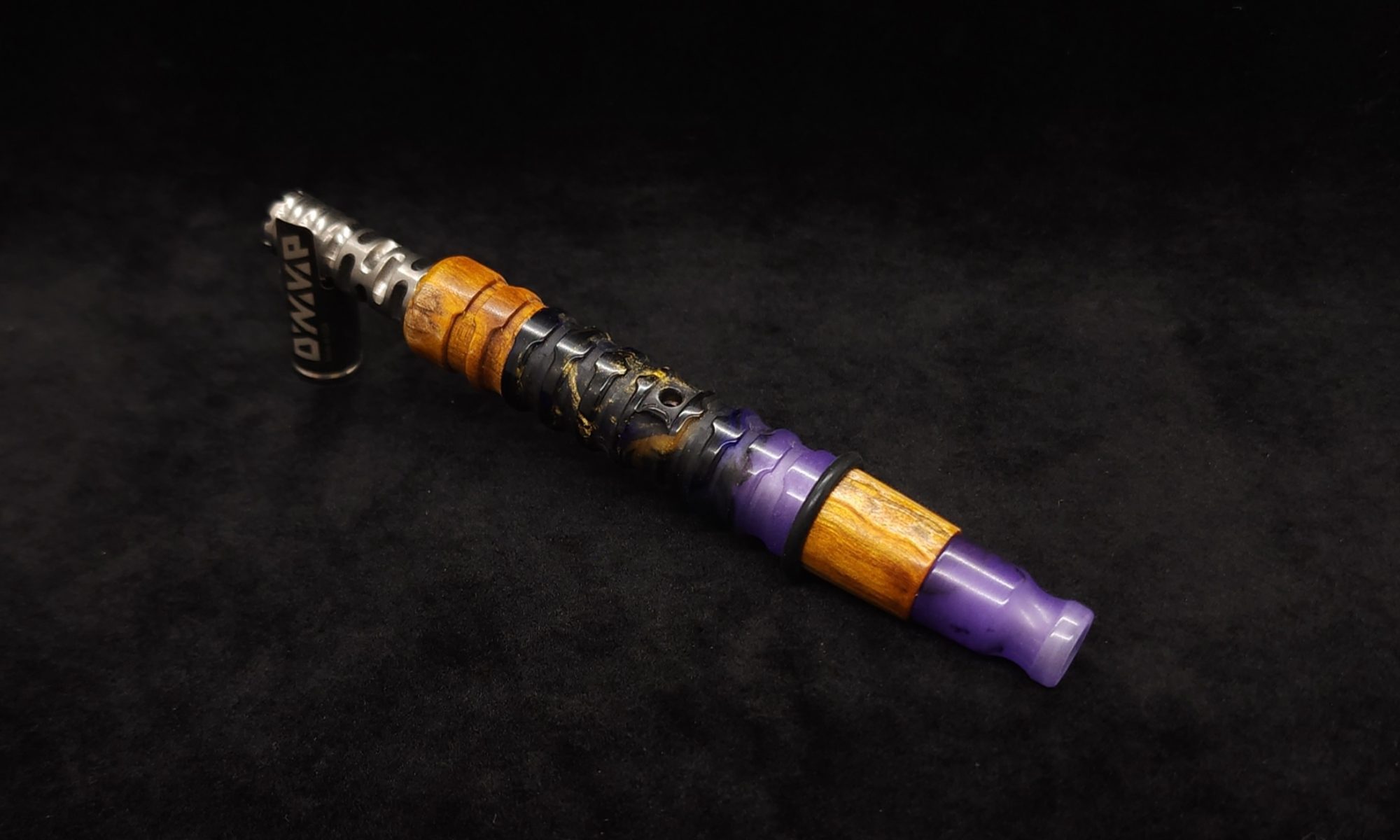 This image portrays Fractured Dynavap XL Hybrid Luminescent Stem + Matching Mouthpiece by Dovetail Woodwork.