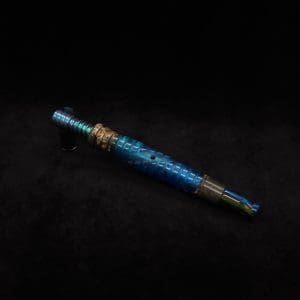 This image portrays Dynavap Omni Tip(OG)-Color Fade-Blue/Green Anodized by Dovetail Woodwork.