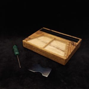 This image portrays DynaTray-Dynavap Stem Display Holder/Sorting Tray-Black Limba by Dovetail Woodwork.