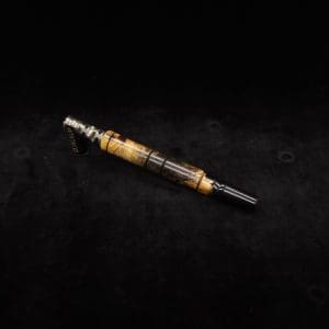 This image portrays Attenuated Dynavap XL Burl Hybrid Stem + Matching Mouthpiece by Dovetail Woodwork.