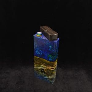 This image portrays Dynavap Device/Material Storage Case-Cosmic Burl (XL) Hybrid by Dovetail Woodwork.