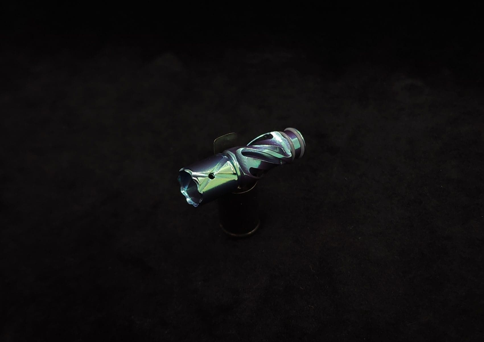 This image portrays Titanium Tip: HELIX-Color Shifting-Emerald Green Anodized by Dovetail Woodwork.