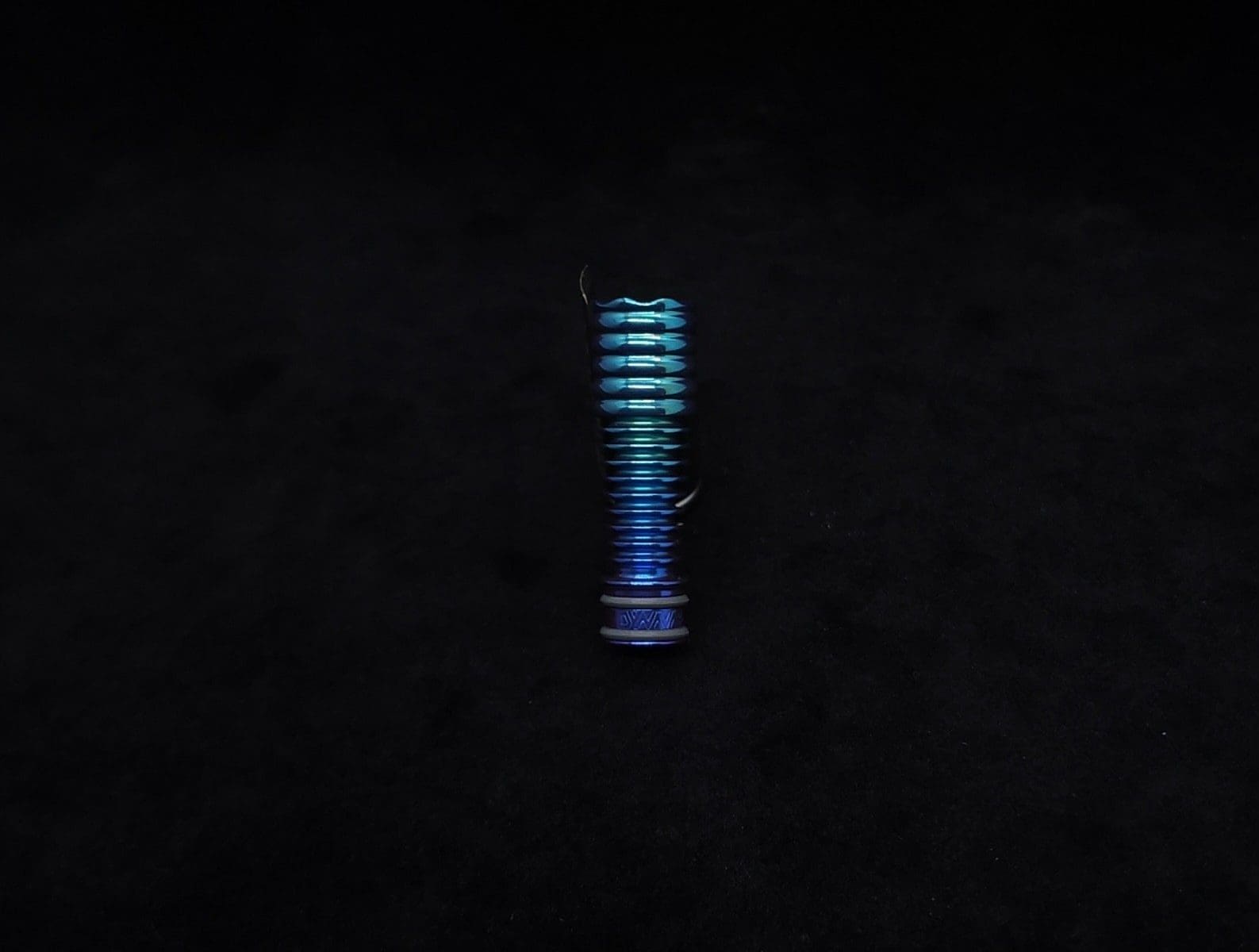 This image portrays DynaVap Titanium Tip: HALO-Green to Blurple-Anodized by Dovetail Woodwork.