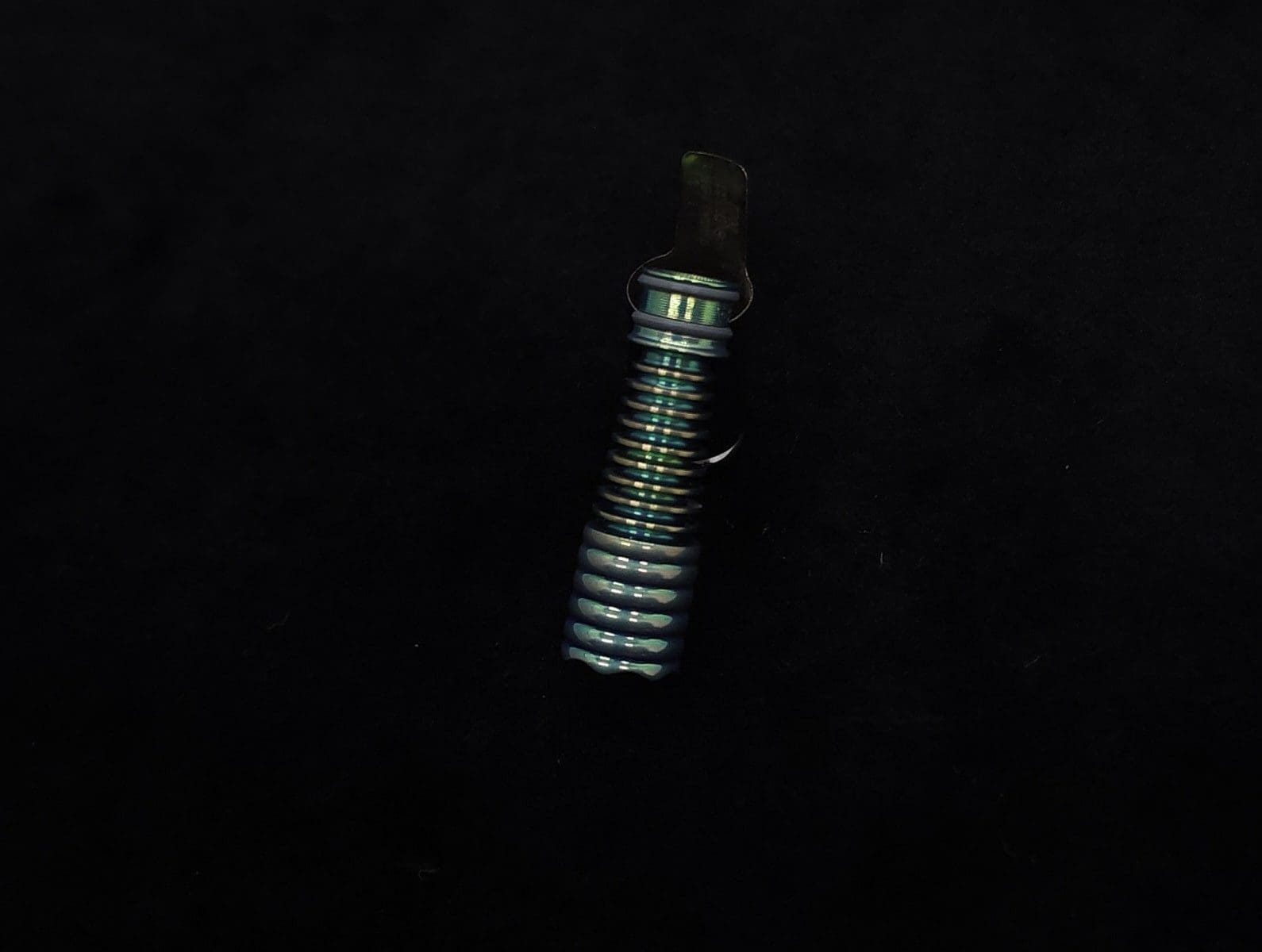 This image portrays DynaVap Titanium Tip: HALO-Green/Gold Fins-Anodized by Dovetail Woodwork.