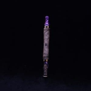 This image portrays The Dynavap WoodWynd-Customized/Anodized Dovetail Woodwork Variant-Special! by Dovetail Woodwork.