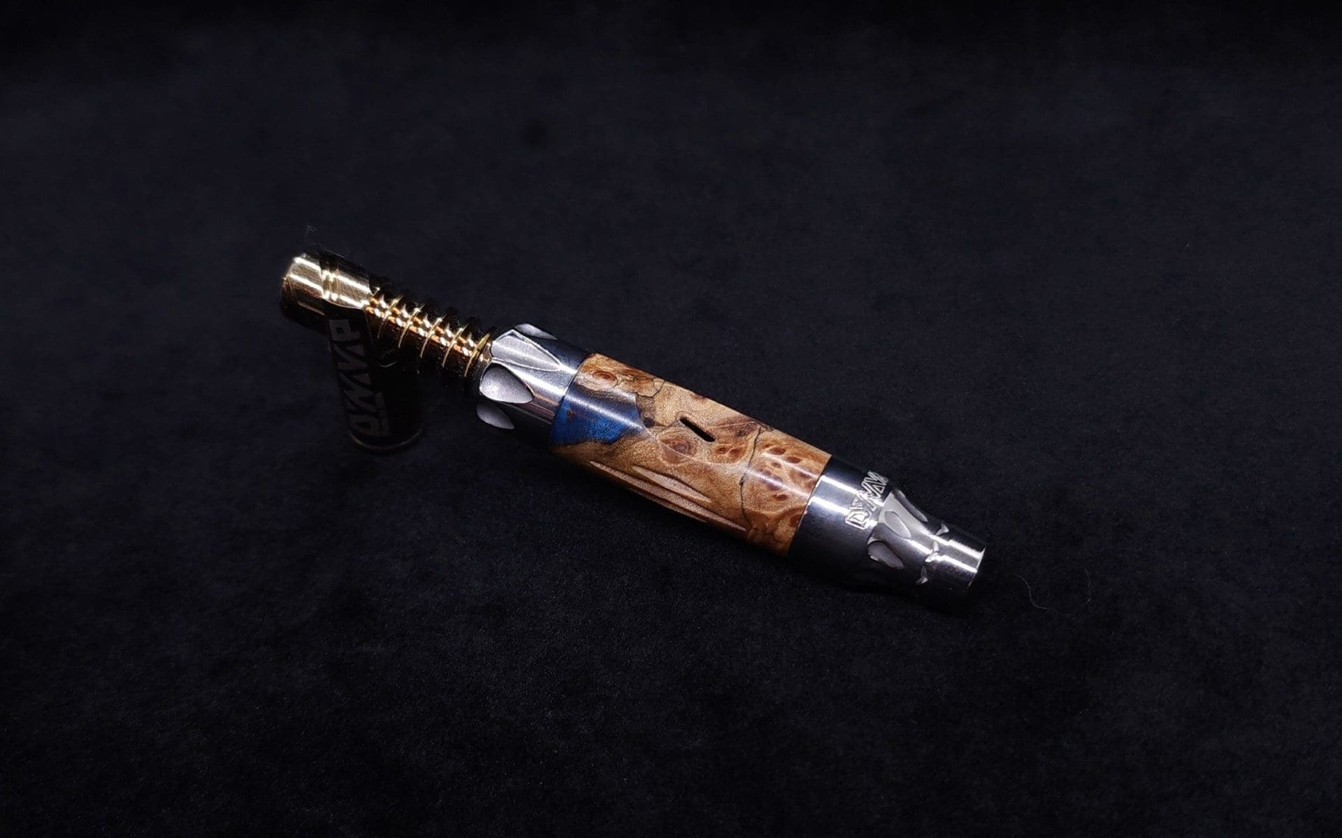 This image portrays Vong[i] Cosmic Burl Sleeve-Highly Figured Maple Burl Hybrid by Dovetail Woodwork.