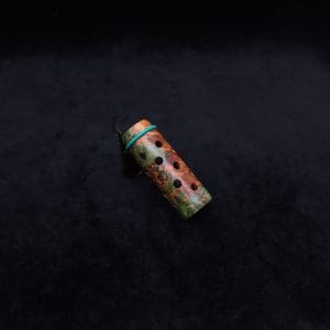 This image portrays Anvil Vestratto Heat Shield Upgrade/Green-Orange Maple Burl by Dovetail Woodwork.