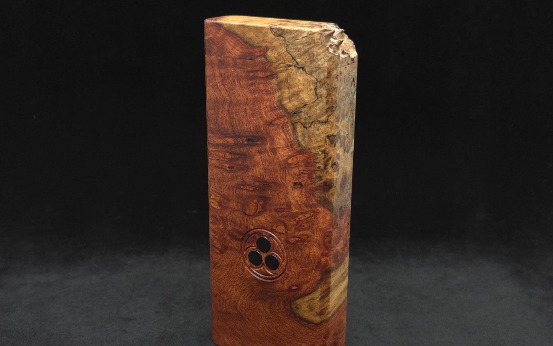 This image portrays Dynavap Dugout Device/Material Storage Case-Live Edge Two-Tone Amboyna Burl XL by Dovetail Woodwork.