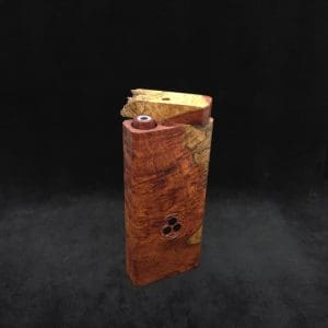 This image portrays Dynavap Dugout Device/Material Storage Case-Live Edge Two-Tone Amboyna Burl XL by Dovetail Woodwork.