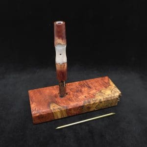This image portrays Dynavap Dugout Device/Material Storage Case-Live Edge Two-Tone Amboyna Burl XL by Dovetail Woodwork.
