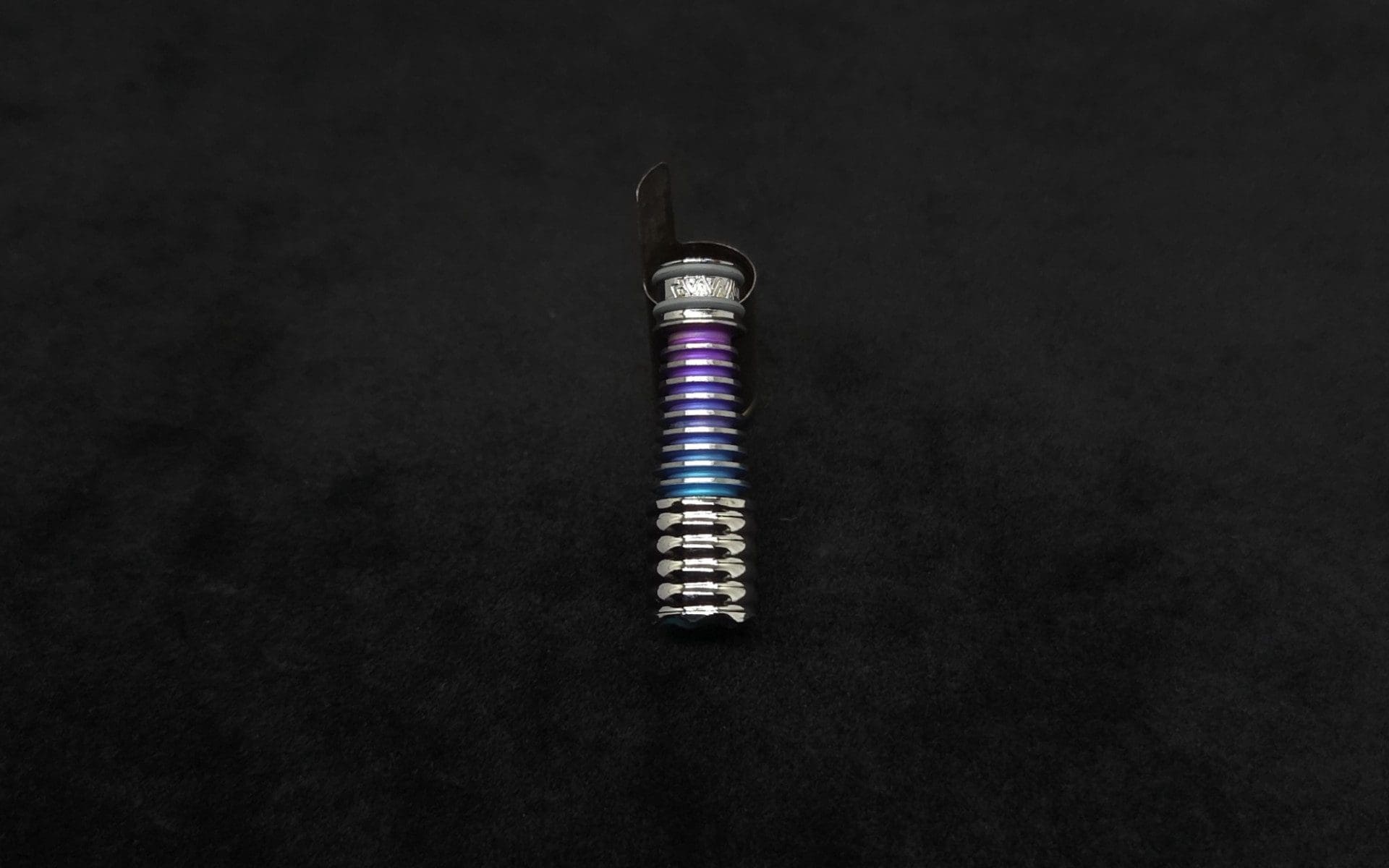 This image portrays DynaVap Titanium Tip: HALO-Polished Titanium/Gradient Blue-Teal-Purple-Anodized by Dovetail Woodwork.