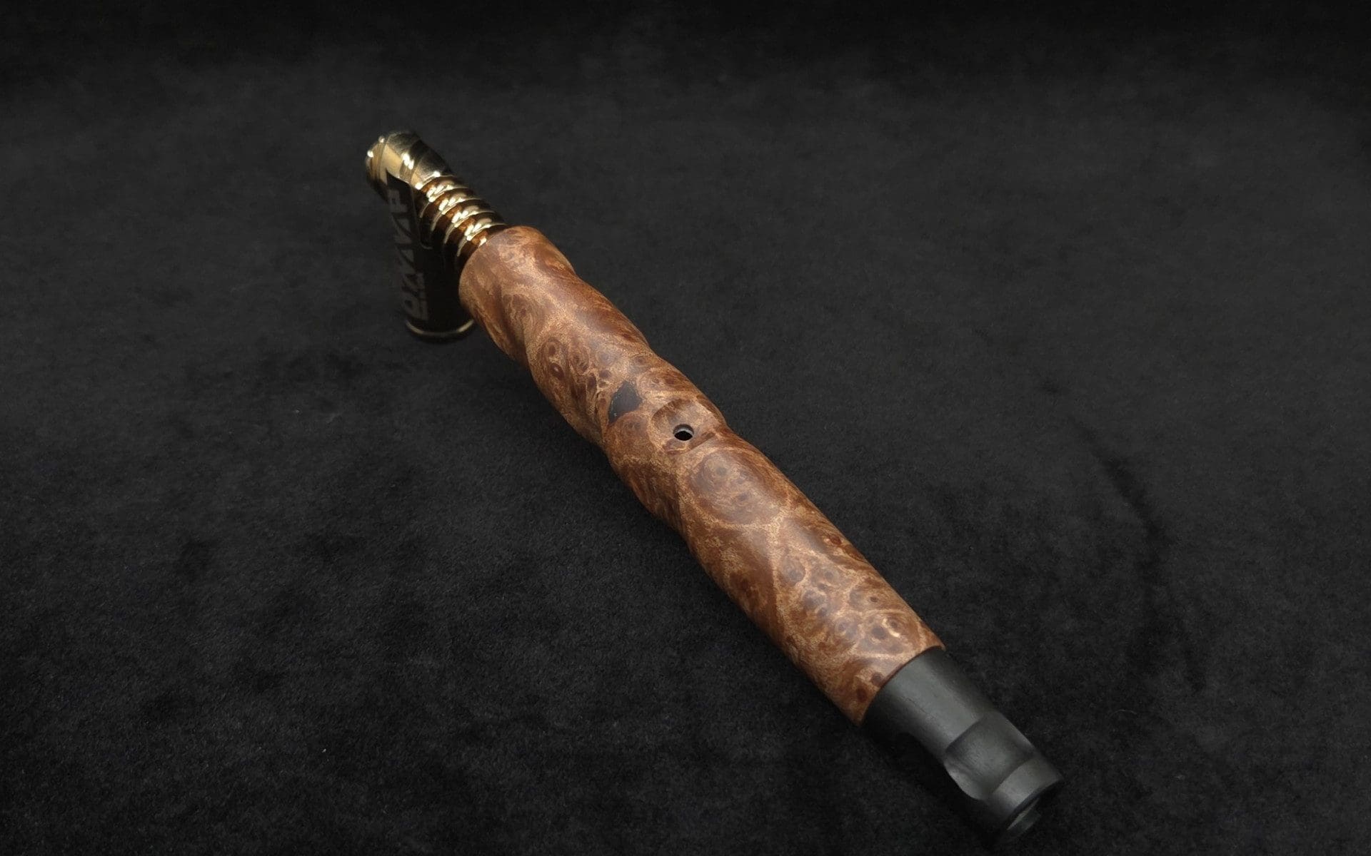 This image portrays Tri-Channel XL Dynavap Stem Highly Figured Maple Burl + Ebony M.P. ☘ by Dovetail Woodwork.
