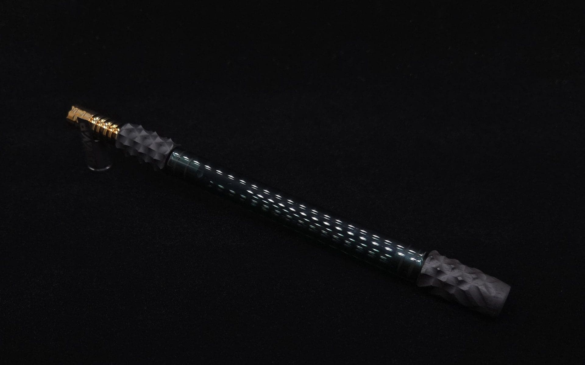 This image portrays Dynavap Reaper Boro-Glass Jr./Ebony Wood Specialty Stem Setup-NEW! by Dovetail Woodwork.