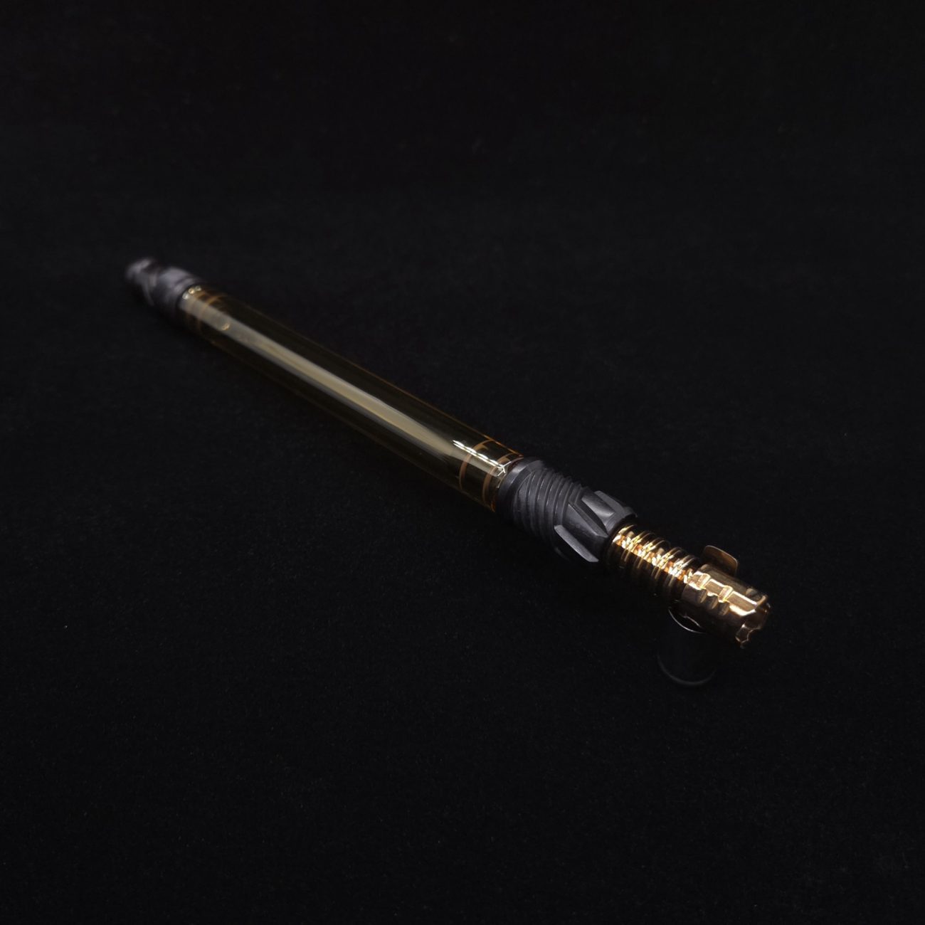 This image portrays Dynavap Vertex Golden Boro-Glass Jr./Ebony Wood Specialty Stem Setup-NEW! by Dovetail Woodwork.